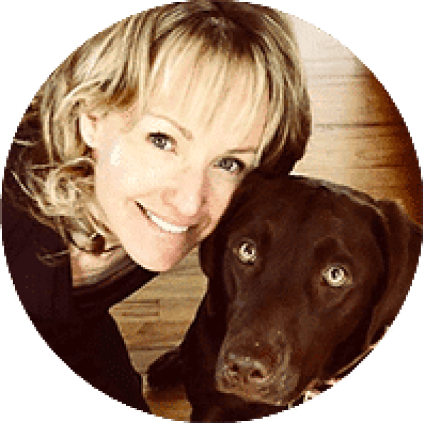 a woman and her dog are smiling for the camera